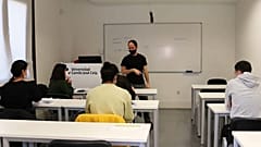 Spanish Professor Andrés Pereira explains his lessons to Afghan refugees at the Camilo José Cela University in Madrid, on January 20, 2022.