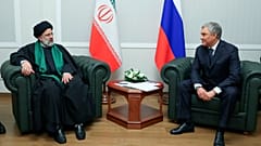 Iranian President Ebrahim Raisi, left, and Russian State Duma speaker Vyacheslav Volodin talk to each other during their meeting in Moscow, Russia, Thursday, Jan. 20, 2022.