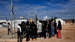 Migrants wait to be registered inside Pournara migrant reception center in Kokkinotrimithia outside the capital Nicosia, Cyprus