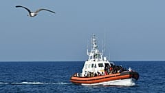 An Italian Guardia Costiera (Coast Guard) boat arrives at a port in Lampedusa.