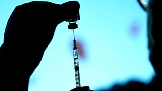 FILE - A dose of a Pfizer COVID-19 vaccine is prepared at Lurie Children's hospital, Nov. 5, 2021, in Chicago.