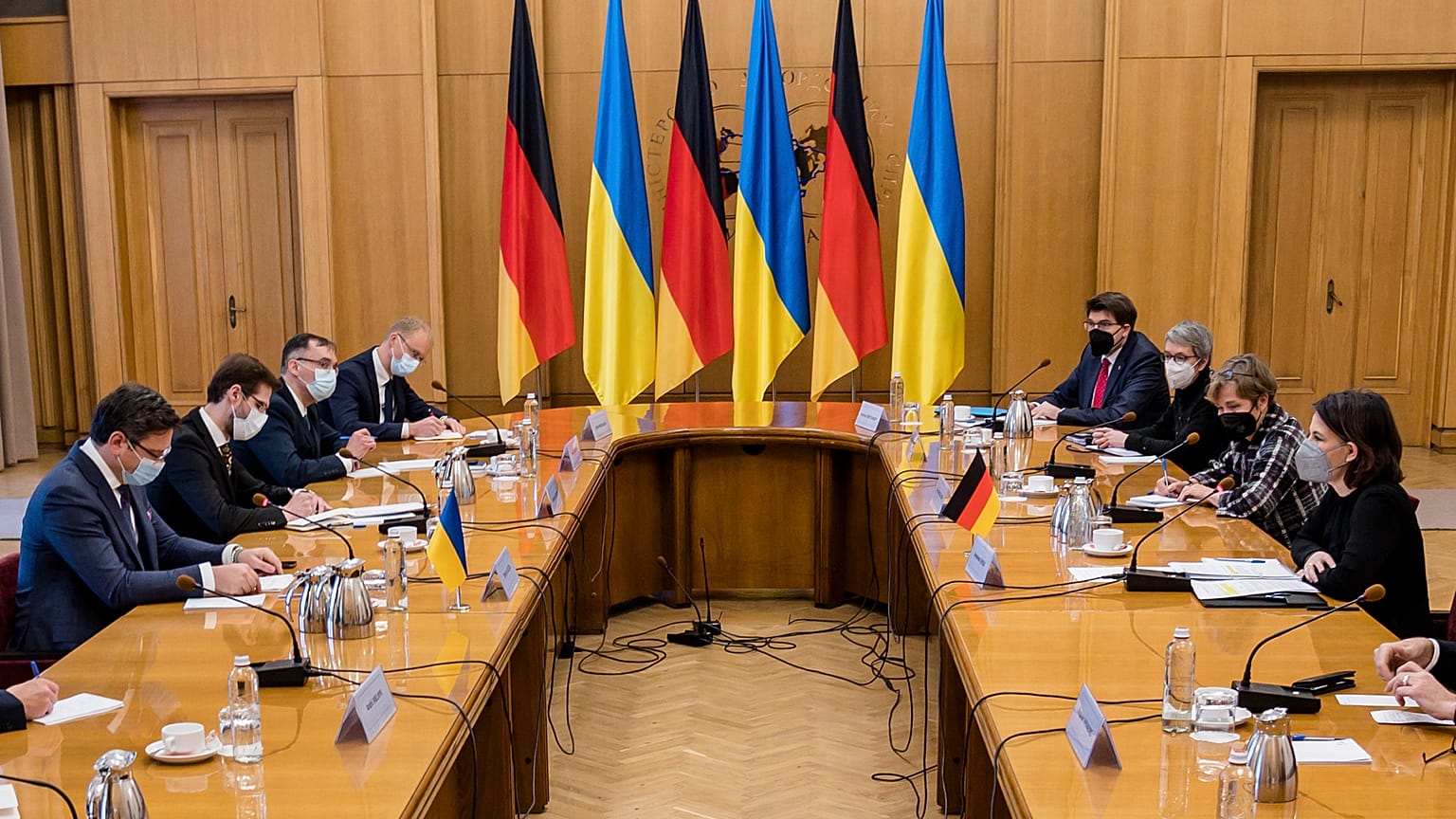 Ukrainian Foreign Minister Dmytro Kuleba, left, and German Foreign Minister Annalena Baerbock, right, attend talks in Kyiv, Ukraine, Monday, Jan. 17, 2022.