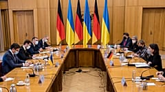 Ukrainian Foreign Minister Dmytro Kuleba, left, and German Foreign Minister Annalena Baerbock, right, attend talks in Kyiv, Ukraine, Monday, Jan. 17, 2022.