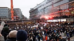 Protestors gather to demonstrate against the coronavirus measures including the vaccine pass, in Stockholm, Sweden, Saturday, Jan. 22, 2022.