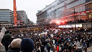 Protestors gather to demonstrate against the coronavirus measures including the vaccine pass, in Stockholm, Sweden, Saturday, Jan. 22, 2022.