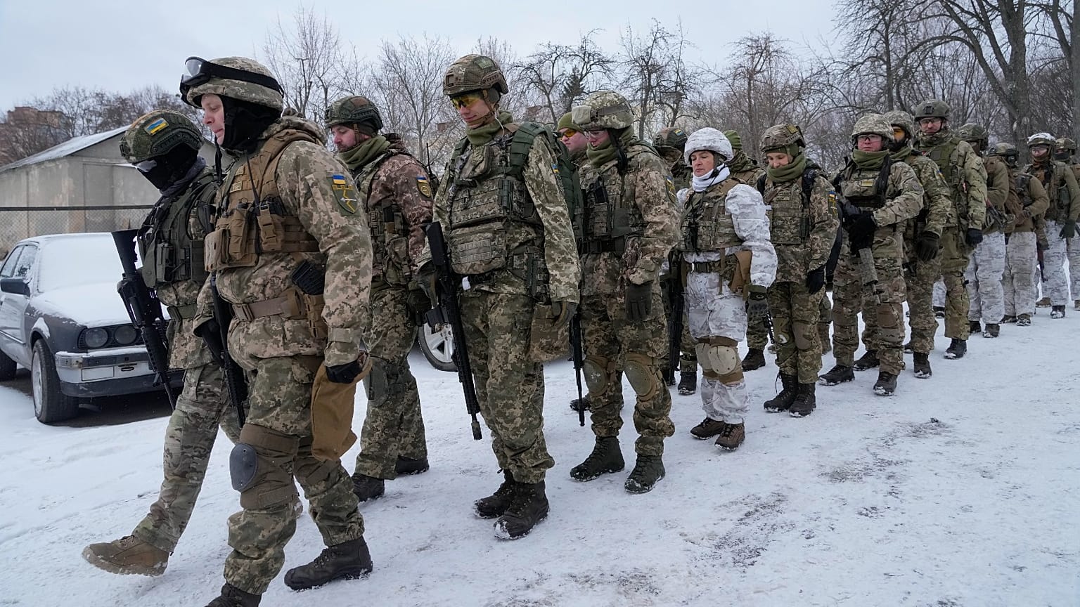 Members of Ukraine's Territorial Defense Forces, volunteer military units of the Armed Forces, train in a city park in Kyiv, Ukraine, Saturday, Jan. 22, 2022. 