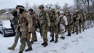 Members of Ukraine's Territorial Defense Forces, volunteer military units of the Armed Forces, train in a city park in Kyiv, Ukraine, Saturday, Jan. 22, 2022. 
