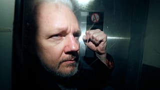 WikiLeaks founder Julian Assange being taken from court, where he appeared on charges of jumping British bail seven years ago, in London, Wednesday May 1, 2019.