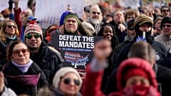 Protesters gather for an anti-vaccine rally in front of the Lincoln Memorial in Washington, Sunday, Jan. 23, 2022. 