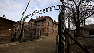 The words "Work Sets You Free" are seen on the gate of the Auschwitz former Nazi death camp in Oswiecim.
