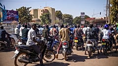 People cheer in support of putschist soldiers near the national television station in Ouagadougou, Monday, Jan. 24, 2022. 