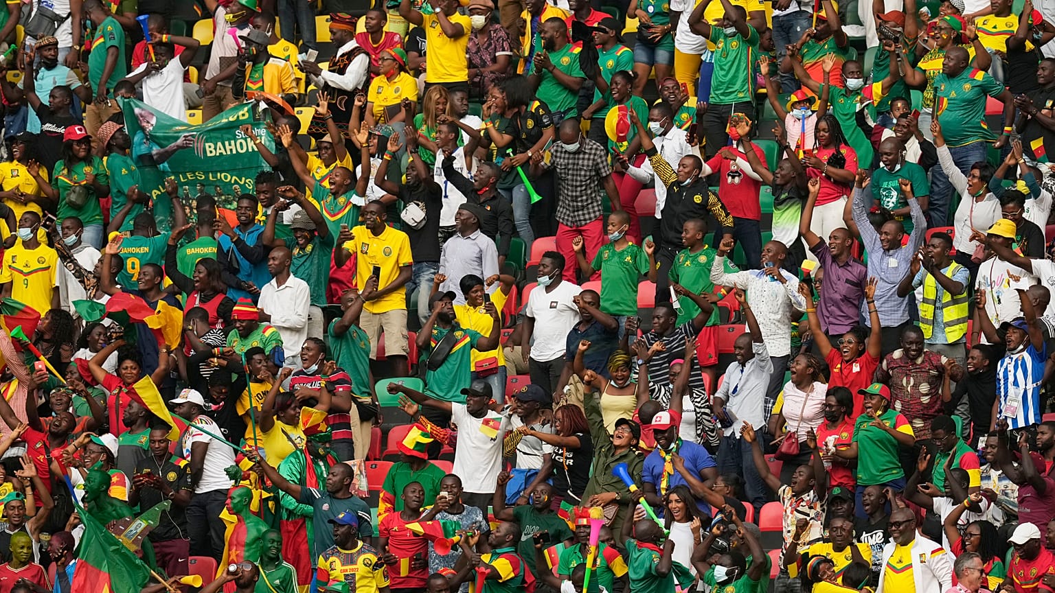 Fans reacts after Cameroon's captain Vincent Aboubakar, scored his team's first goal, during the African Cup of Nations at the Olembe stadium in Yaounde, Cameroon.