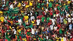 Fans reacts after Cameroon's captain Vincent Aboubakar, scored his team's first goal, during the African Cup of Nations at the Olembe stadium in Yaounde, Cameroon.