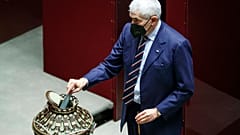Lawmaker Pier Ferdinando Casini casts his ballot during the first round of votes in the Italian parliament, Monday, Jan. 24, 2022.
