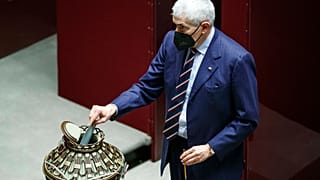 Lawmaker Pier Ferdinando Casini casts his ballot during the first round of votes in the Italian parliament, Monday, Jan. 24, 2022.