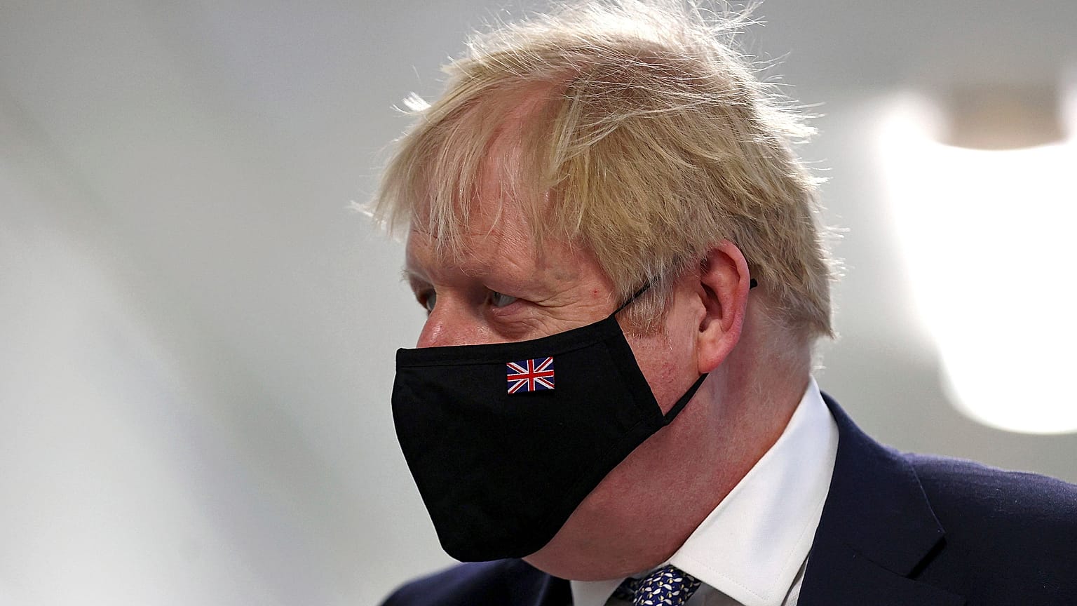 Britain's Prime Minister Boris Johnson wears a face mask, during a visit to Milton Keynes University Hospital in Buckinghamshire, England, Monday, Jan. 24, 2022. 