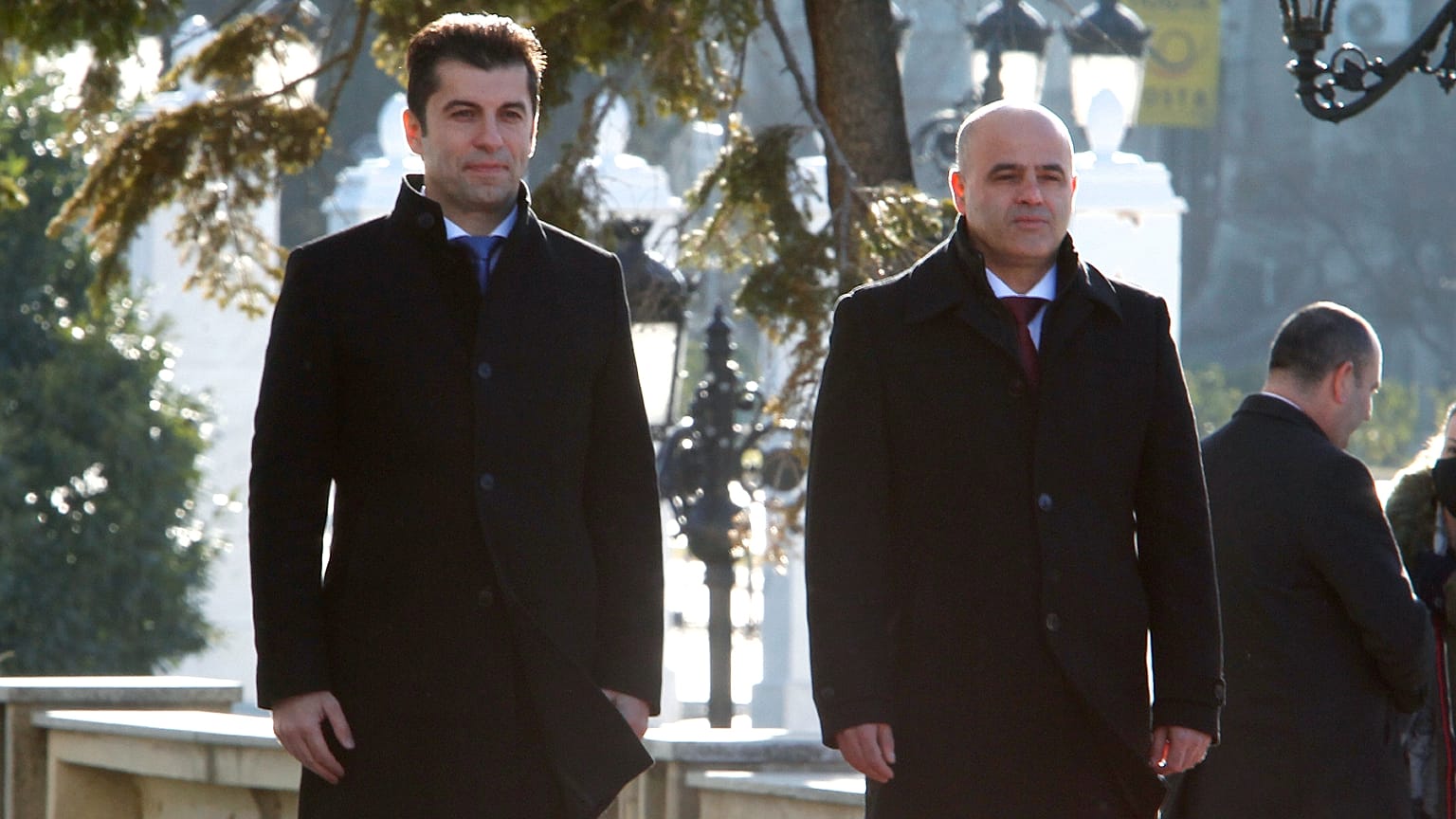 Bulgaria's PM Kiril Petkov (L) and North Macedonia's PM Dimitar Kovacevski (R) stand for the national anthems during a welcoming ceremony in Skopje, Jan. 18, 2022. 