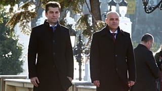 Bulgaria's PM Kiril Petkov (L) and North Macedonia's PM Dimitar Kovacevski (R) stand for the national anthems during a welcoming ceremony in Skopje, Jan. 18, 2022. 