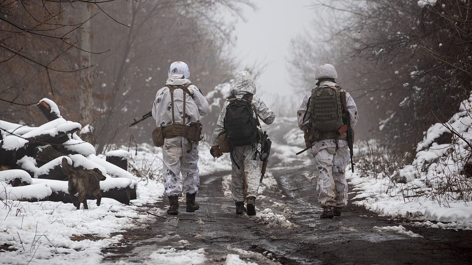 Ukrainian soldiers walks at the line of separation from pro-Russian rebels near Katerinivka, Donetsk region, Ukraine, 7 December 2021.