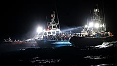The migrants were located on a packed wooden boat off the coast of the Italian island of Lampedusa.