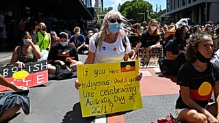 Protesters take part in an "Invasion Day" demonstration on Australia Day in Sydney on January 26, 2022.
