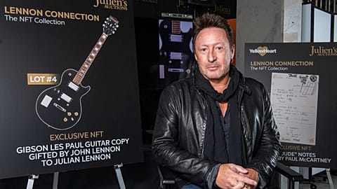Artist/musician Julian Lennon poses in front of the NFT (non-fungible token) part of "Lennon Connection: The NFT Collection" auction.