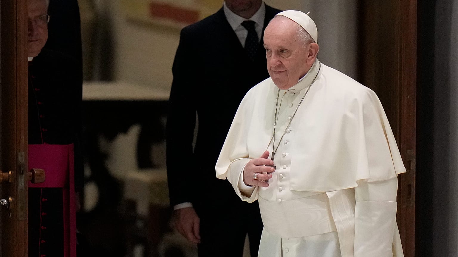 Pope Francis arrives to attend his weekly general audience in the Paul VI Hall at the Vatican, Wednesday, Jan. 26, 2022.