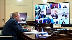 Russian President Vladimir Putin chairs a meeting with Italian businessmen via videoconference at the Novo-Ogaryovo residence outside Moscow, Russia, Wednesday, Jan. 26, 2022.