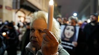 People gather before Poland's Constitutional Tribunal in Warsaw, Poland, on Saturday, Nov. 6, 2021, to protest restrictive abortion law that critics say led to a recent death
