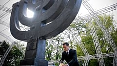 Ukrainian President Volodymyr Zelenskyy attends a ceremony at the monument to Jewish victims of Nazi massacres in Ukraine's capital Kyiv, Wednesday, Sept. 29, 2021. 