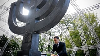 Ukrainian President Volodymyr Zelenskyy attends a ceremony at the monument to Jewish victims of Nazi massacres in Ukraine's capital Kyiv, Wednesday, Sept. 29, 2021. 