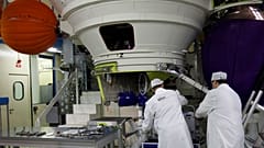 Technicians work on an Ariane 5 rocket engine northwest of Paris.