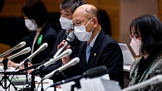 Lawyer Kenichi Ido speaks during a press conference in Tokyo on January 27, 2022.