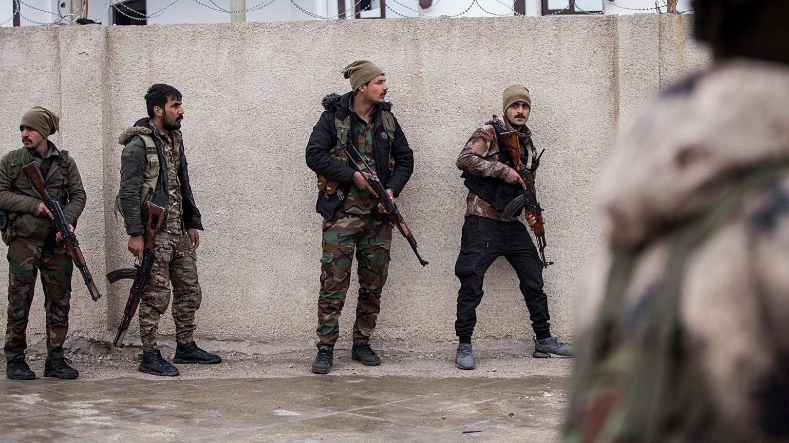 Syrian Democratic Forces soldiers hold a position in Hassakeh, northeast Syria, Thursday, Jan. 27, 2022