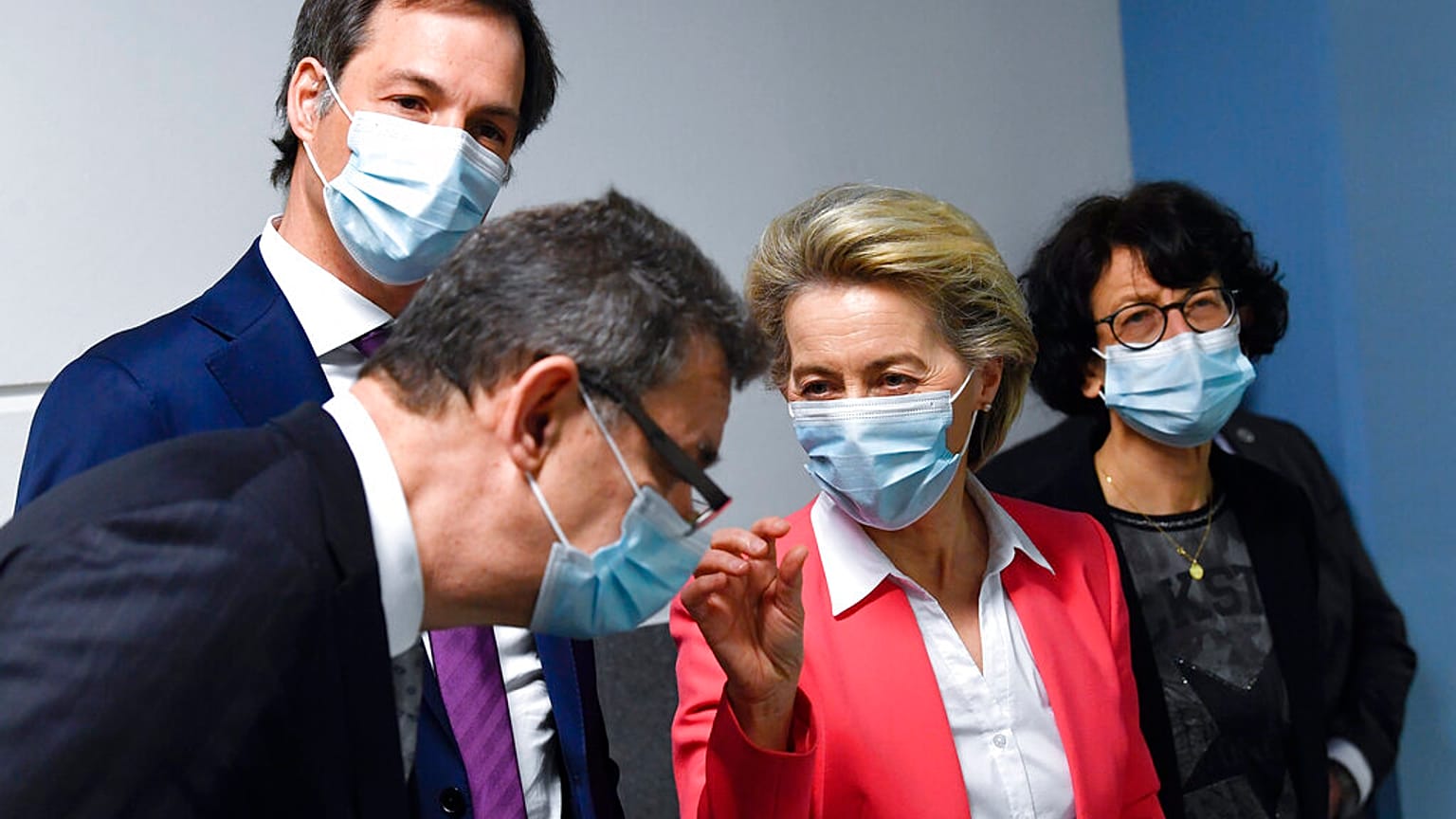  European Commission President Ursula von der Leyen, second right, speaks with Pfizer CEO Albert Bourla, left, and Belgium's Prime Minister Alexander De Croo, second left.