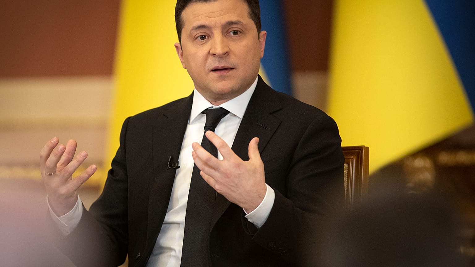 In this handout photo provided by the Ukrainian Presidential Press Office, Ukrainian President Volodymyr Zelenskyy speaks during a news conference in Kyiv, Jan. 28, 2022.