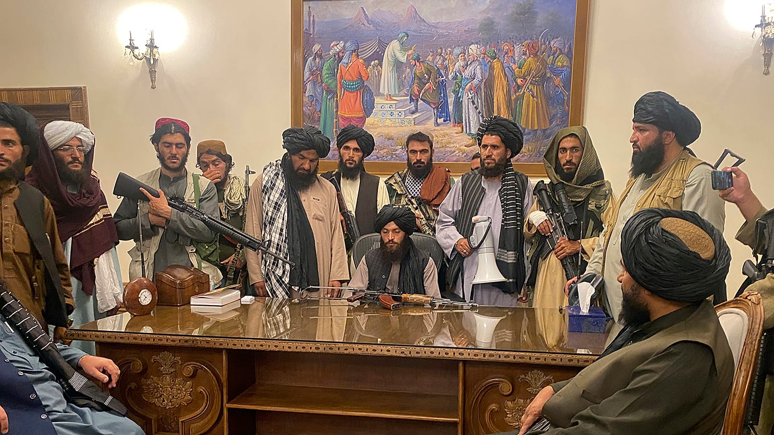 Taliban fighters take control of Afghan presidential palace in Kabul after President Ashraf Ghani fled the country.
