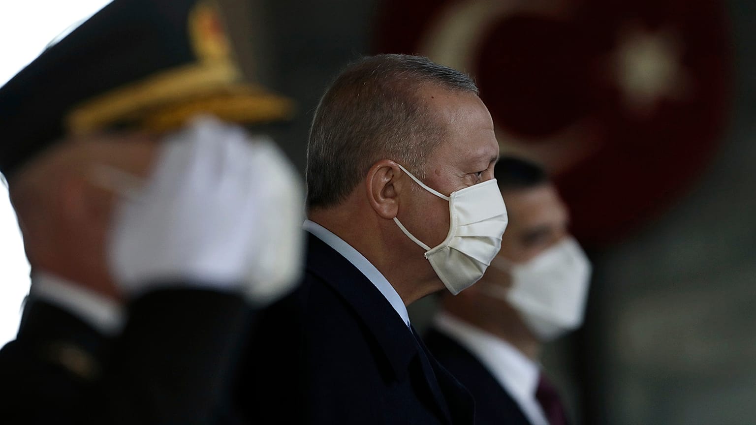 Turkey's President Recep Tayyip Erdogan stands with other Turkish leaders to lay a wreath on Republic Day, in Ankara