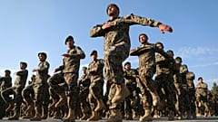 Newly graduated Afghan National Army personnel march during their graduation ceremony at the Afghan Military Academy in Kabul, Afghanistan. November 2020.