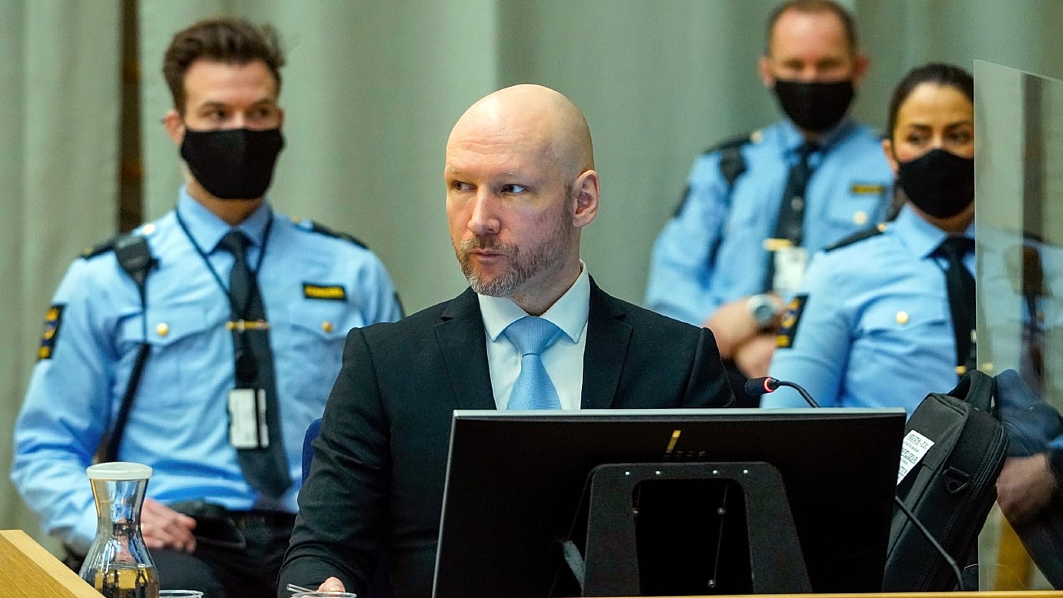 Convicted mass murderer Anders Behring Breivik sits in the makeshift courtroom in Skien prison on the second day of his parole hearing, Norway, Jan. 19, 2022.