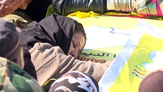 People mourning during the funeral of members of the Syrian Democratic Forces (SDF) in the northeastern Syrian town of al-Malikiya