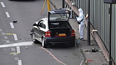 An investigator pictured at the scene on the BAB 100 motorway near Berlin.