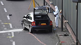 An investigator pictured at the scene on the BAB 100 motorway near Berlin.
