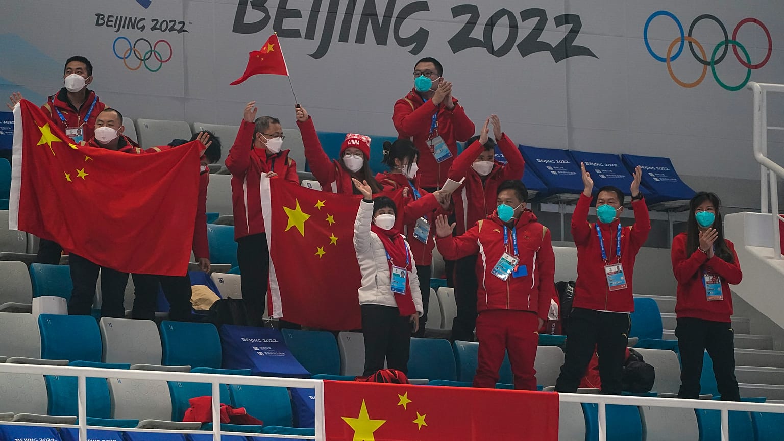 Chinese fans cheer after a China win against Australia during the mixed doubles curling match at the Beijing Winter Olympics Thursday, Feb. 3, 2022, in Beijing. 