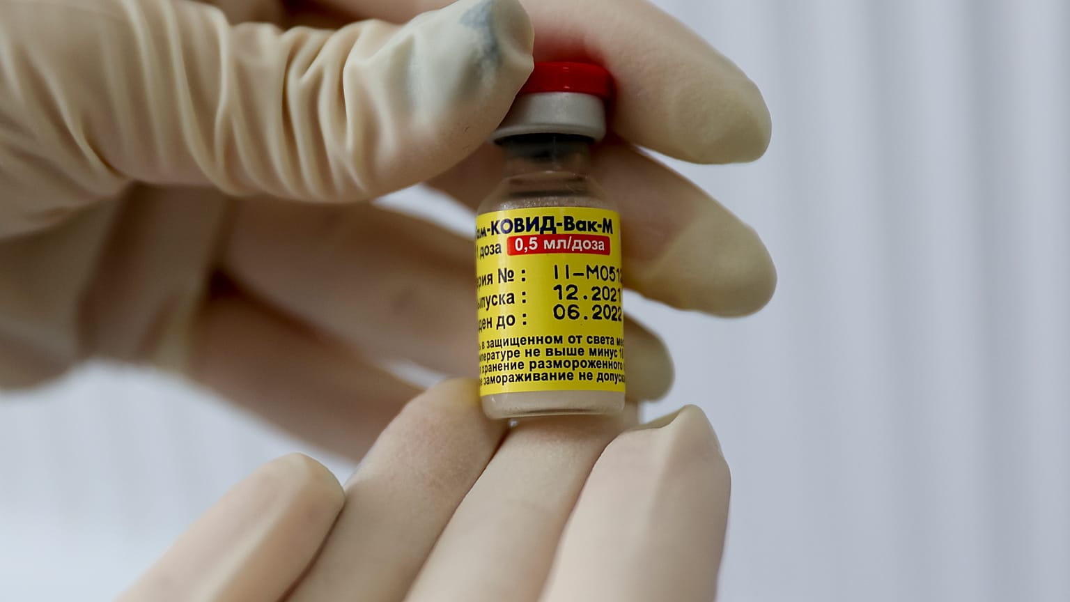 A medical worker holds a dose of Russia's Sputnik M (Gam-COVID-Vac-M) COVID-19 vaccine in Krasnodar, Russia, Friday, Jan. 28, 2022.