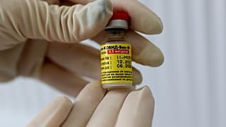 A medical worker holds a dose of Russia's Sputnik M (Gam-COVID-Vac-M) COVID-19 vaccine in Krasnodar, Russia, Friday, Jan. 28, 2022.
