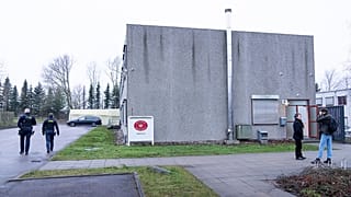 Armed Police officers patrol outside the specially builty courtroom in Roskildes.