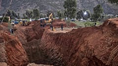 Civil defense and local authorities dig in an attempt to rescue the boy near the town of Bab Berred.