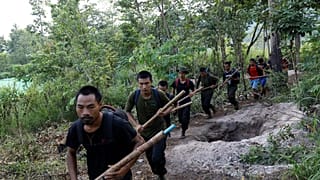 Members of the People's Defence Force, the armed wing of the civilian National Unity Government opposed to Myanmar's ruling military regime, taking part in training at a camp 