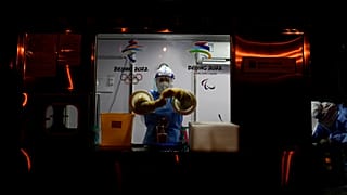 A worker prepares to administer a COVID-19 test at the 2022 Winter Olympics, 2 February 2022, in Beijing